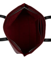 Burgundy tote bag with a long handle